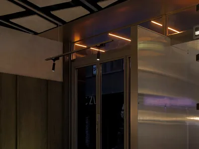 An industrial-style restaurant interior with a metal breakfast counter.