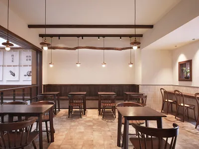 A modern restaurant interior with wooden furniture and tiled flooring.