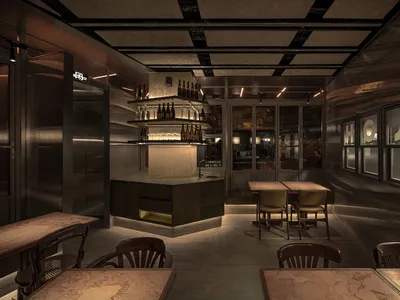 An industrial-themed restaurant interior with metal, glass, and wood elements.