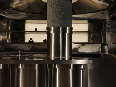 Modern, sleek restaurant kitchen counter made of metal.