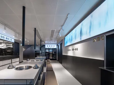 Industrial-style restaurant interior with dark materials and modern design elements