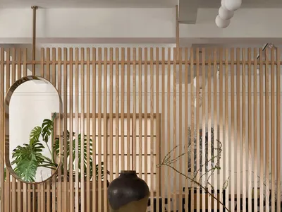 Modern restaurant interior featuring wooden walls and furniture.