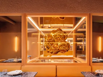 Modern restaurant interior with a metallic, futuristic design element
