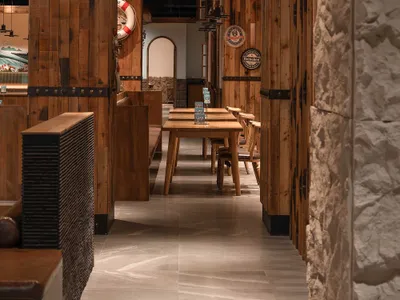 Industrial-themed retail storefront with wooden paneling and rustic decor.