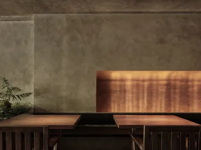 A modern restaurant interior featuring a combination of concrete and wooden elements with warm lighting.