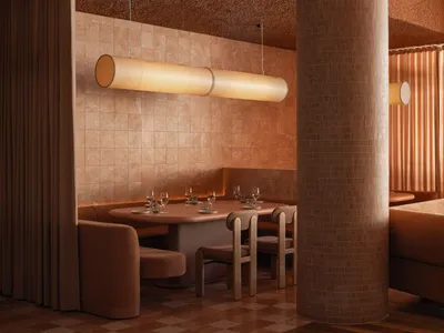 A modern restaurant interior with textured tiles and wooden furnishings, featuring industrial design elements.