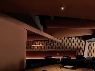 A modern restaurant interior featuring brick and wooden elements.