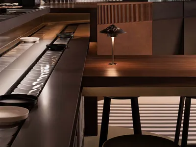 Industrial-style restaurant interior with metal and glass structural elements