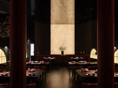 A beautifully designed modern restaurant interior featuring marble and leather materials.