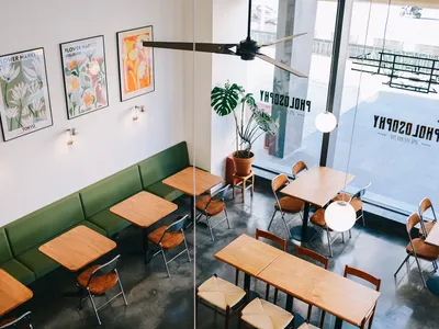 Interior design of a modern restaurant with contemporary seating, tables, and decorative elements.