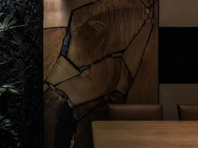 Modern restaurant interior with a focus on wooden decor elements.