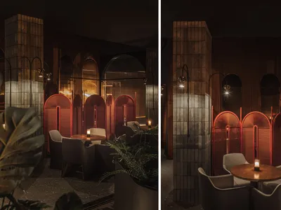 Industrial-themed restaurant interior with red metallic screens and dim lighting