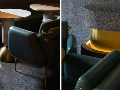 Modern restaurant furniture featuring leather, metal, marble, and concrete materials.