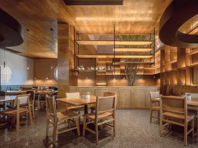 Modern restaurant interior designed with wooden materials and minimalist design