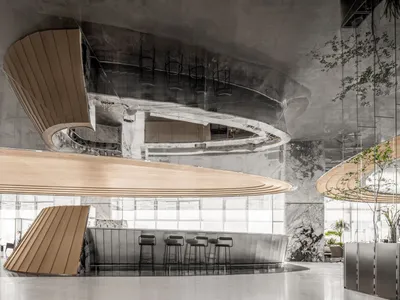 Modern bar area with marble finish and stools.