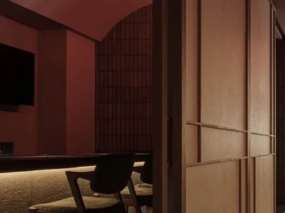 A modern restaurant booth illuminated by camera lighting, featuring a wooden textured wall.
