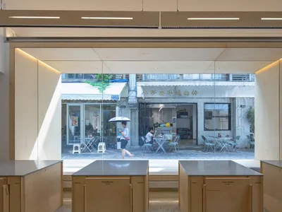 Modern cafe interior with wood, glass, and concrete elements