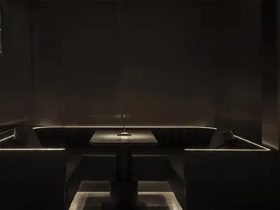 Industrial-inspired restaurant booth with metal accents