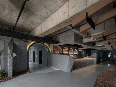 Concrete walls and ceiling of a restaurant bar interior