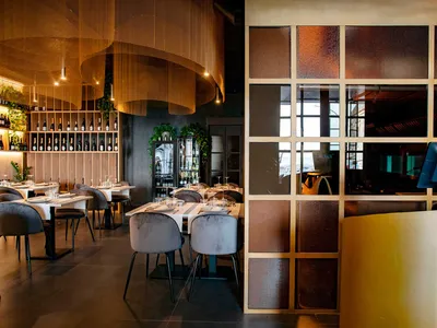 Modern restaurant interior with metal and glass materials