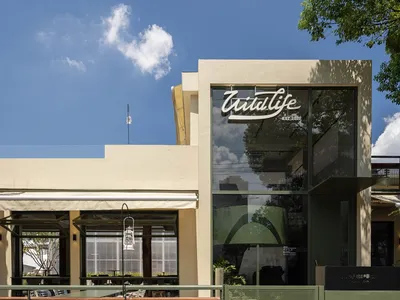 A modern restaurant exterior with a glass window