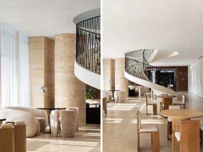 A modern hotel lobby featuring stone and concrete materials for a sophisticated and elegant atmosphere.