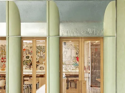 Modern restaurant shopfront featuring wooden elements and glass panels