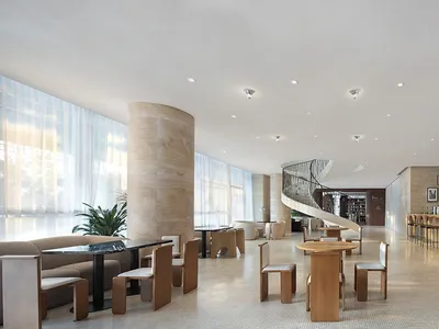 Modern hotel lobby featuring marble, wood, and glass materials.
