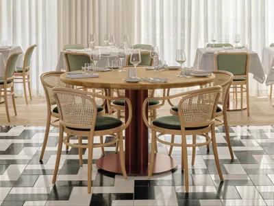 A modern dining room with wooden tables and chairs, white curtains, and a white chandelier.