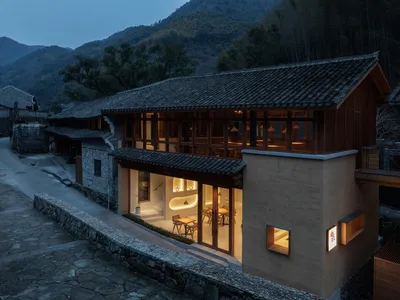 Modern restaurant exterior with wooden frame and glazed roof tiles