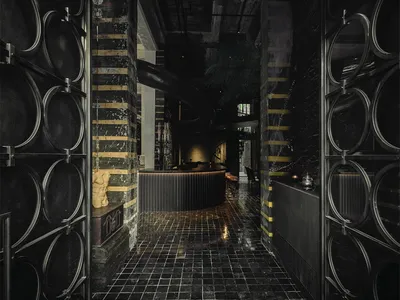 A modern hotel interior featuring glass and metallic accents.