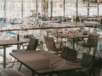 Modern restaurant interior with metallic tables and chairs