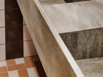 Modern minimalist bathroom featuring a concrete countertop and sink.