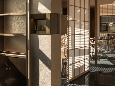 Modern restaurant interior featuring tiled floors and wooden accents