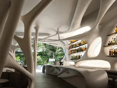 An interior design featuring modern concrete structures in a restaurant bar setting.