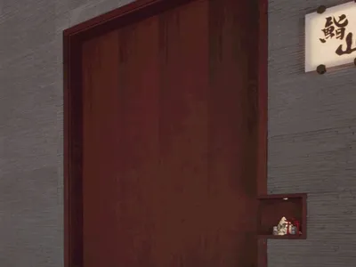 Modern restaurant entrance featuring wooden gates and a concrete wall.