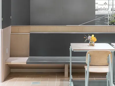 A minimalist restaurant interior with modern furniture and a sleek, contemporary design.