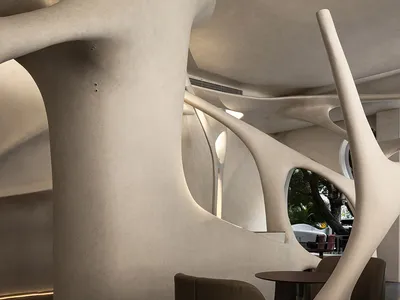 Modern restaurant interior with concrete and steel features