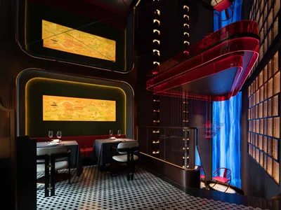 A modern restaurant interior featuring acrylic lighting and mixed materials.