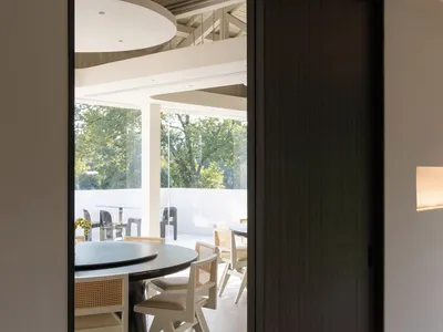 Industrial restaurant interior with metallic counter and chairs