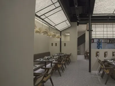 Modern restaurant interior designed with contemporary materials.