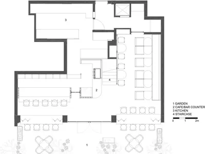 Floor plan of a minimalist coffee shop interior with seating areas, a bar counter, and a kitchen.