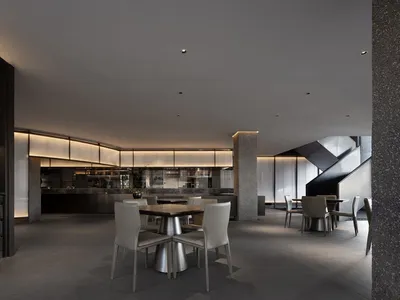 Modern restaurant dining area with sleek furniture and contemporary design elements.