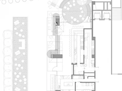 Floor plan of a modern restaurant featuring metal and glass elements.