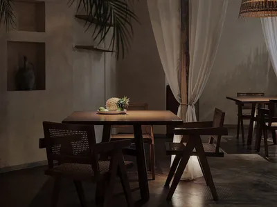 A rustic restaurant interior with wooden furniture, hanging wicker lights, and minimalist decor.