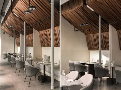 Modern, minimalist restaurant interior with concrete, glass, and wooden elements.
