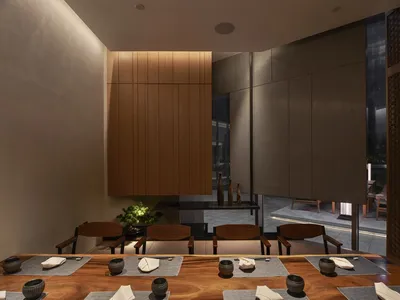 A modern restaurant interior with wooden accents, featuring tables, chairs, and decorative elements.