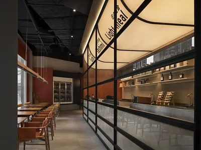 Modern restaurant interior with glass cabinets and warm lighting.