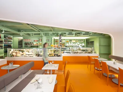 A modern cafe restaurant interior with a bright, open design featuring lightweight construction materials.