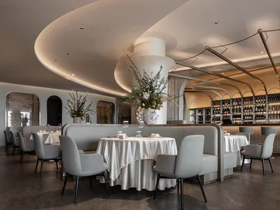 Contemporary restaurant interior with concrete walls and plaster finishes